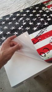 Remove cornhole wrap backing starting at the corner