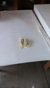 Clean the back of the cornhole wrap with tack cloth